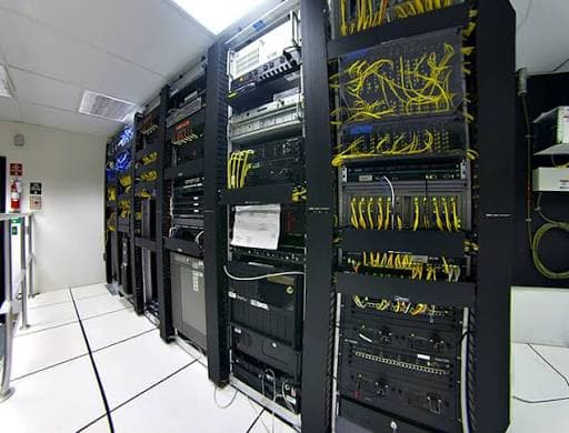 Server room with racks of networking and compute equipment